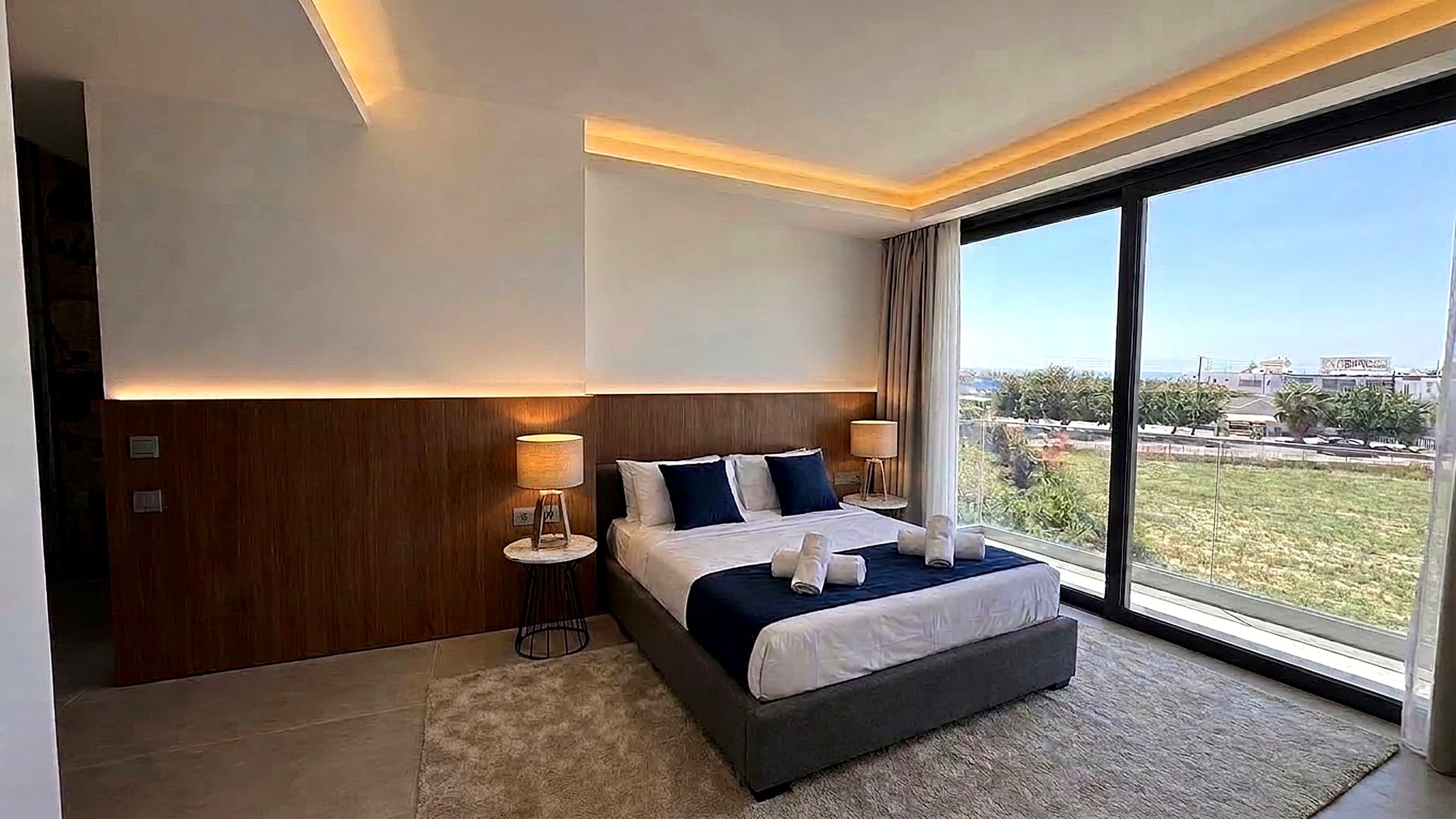 Bedroom with walnut panelling, day